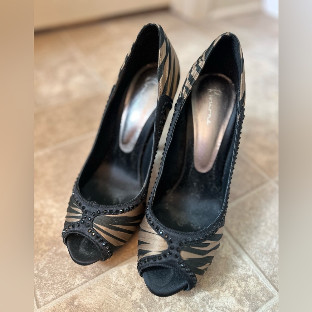 Women’s Bourne Black and Gold Peep-Toe Heels with black crystal embellishment.